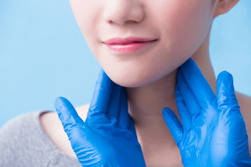 Examining patient's neck for loose skin